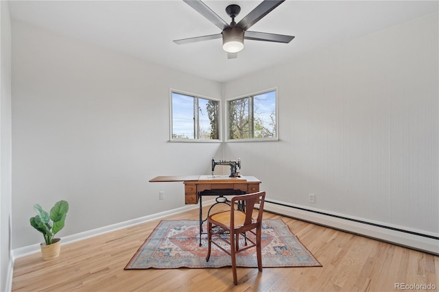 865 S Everett St, Lakewood, CO 80226 - office space featuring baseboards, a baseboard heating unit, ceiling fan, and wood finished floors