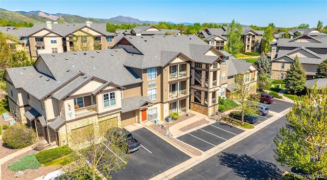aerial view of residential area featuring a mountain backdrop