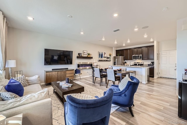 21613 E 59th Pl, Aurora, CO 80019 - living area with light wood-style flooring and recessed lighting