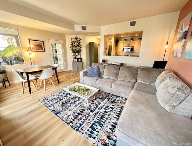 300 W 11th Ave Unit 10D, Denver, CO 80204 - living room featuring light wood finished floors and baseboards