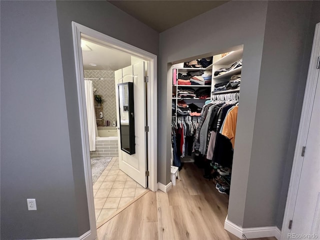 300 W 11th Ave Unit 10D, Denver, CO 80204 - walk in closet with light wood-style floors
