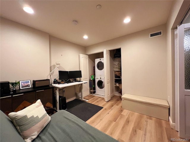 300 W 11th Ave Unit 10D, Denver, CO 80204 - living room featuring stacked washing machine and dryer, light wood-style flooring, an office area, recessed lighting, and baseboards