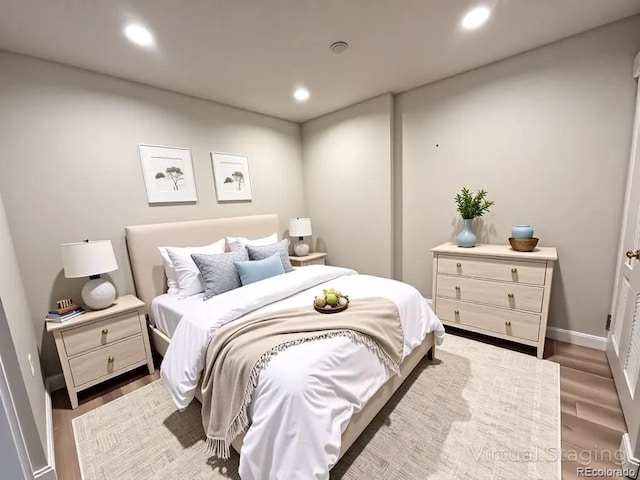 300 W 11th Ave Unit 10D, Denver, CO 80204 - bedroom featuring wood finished floors and recessed lighting