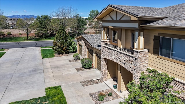 11374 Xavier Dr Unit 202, Westminster, CO 80031 - view of patio featuring a mountain view and a garage