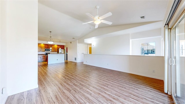 11374 Xavier Dr Unit 202, Westminster, CO 80031 - unfurnished living room with lofted ceiling, light wood finished floors, a ceiling fan, and baseboards