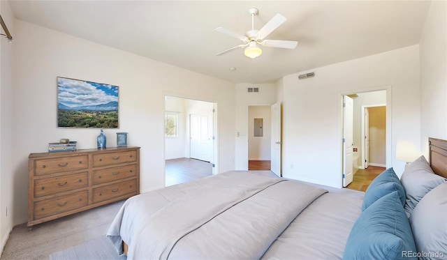 11374 Xavier Dr Unit 202, Westminster, CO 80031 - bedroom featuring ceiling fan, baseboards, electric panel, and light wood-style flooring