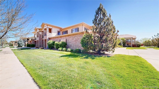 11374 Xavier Dr Unit 202, Westminster, CO 80031 - view of front of house featuring a front yard and brick siding