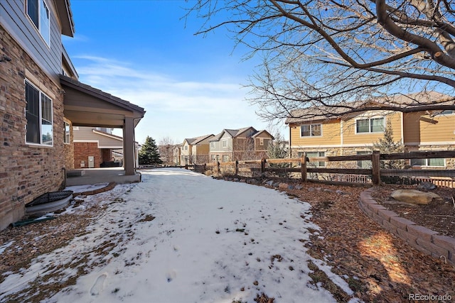 view of yard layered in snow