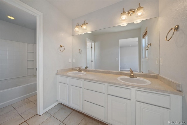 bathroom with tub / shower combination, tile patterned floors, and vanity