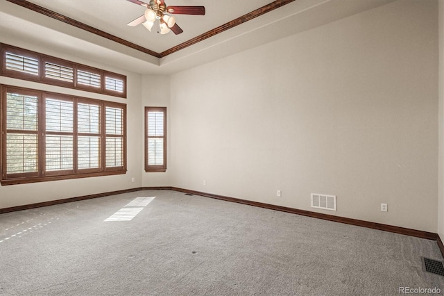 unfurnished room with carpet floors, baseboards, and visible vents