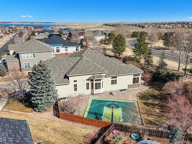 view of pool with a residential view and fence