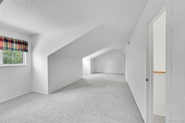 10369 E Red Mtn, Littleton, CO 80127 - bonus room with carpet floors, a textured ceiling, and vaulted ceiling