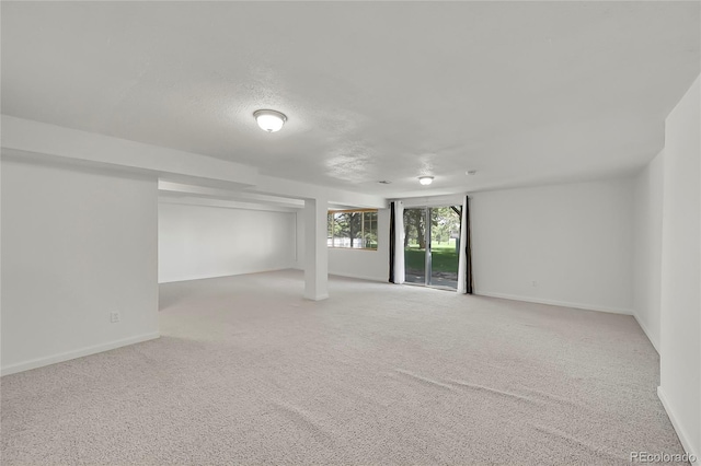10369 E Red Mtn, Littleton, CO 80127 - below grade area featuring light colored carpet and baseboards