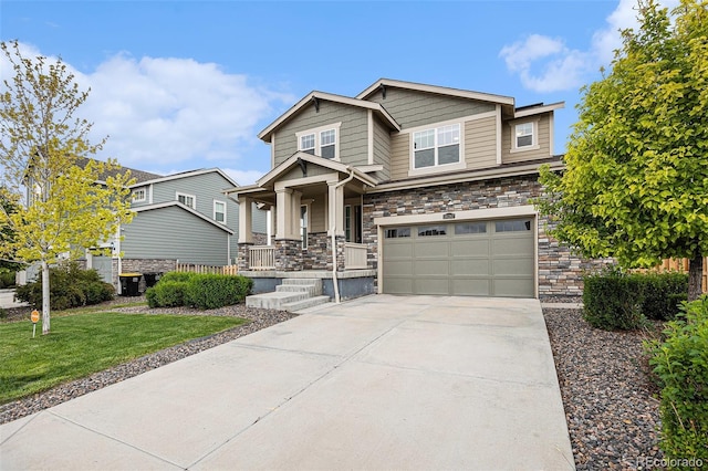 26267 E 3rd Ave, Aurora, CO 80018 - craftsman-style house featuring stone siding, covered porch, a garage, and driveway