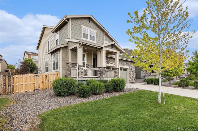 26267 E 3rd Ave, Aurora, CO 80018 - craftsman house featuring covered porch, driveway, and stone siding