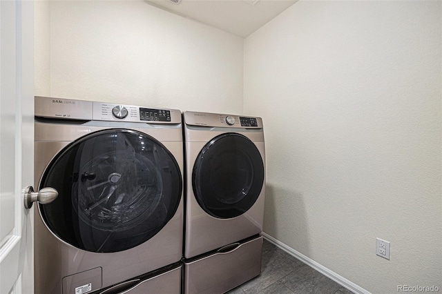 26267 E 3rd Ave, Aurora, CO 80018 - laundry area with washer and dryer and baseboards