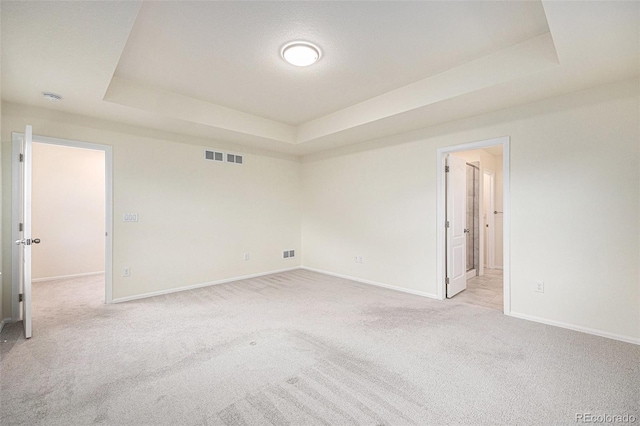 26267 E 3rd Ave, Aurora, CO 80018 - unfurnished room with a raised ceiling and light carpet