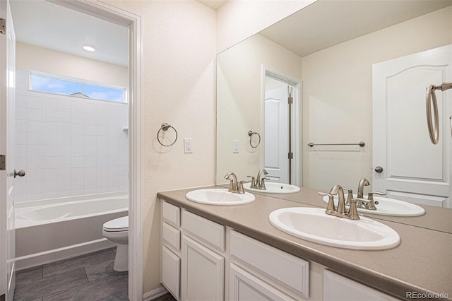 26267 E 3rd Ave, Aurora, CO 80018 - bathroom with double vanity and bathtub / shower combination