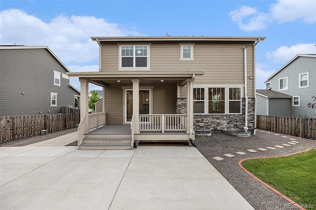 26267 E 3rd Ave, Aurora, CO 80018 - back of property featuring stone siding and a patio