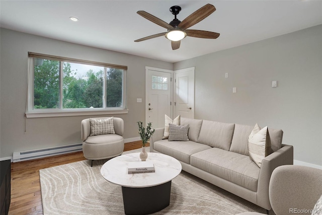 9743 W 67th Pl, Arvada, CO 80004 - living area featuring a baseboard heating unit, ceiling fan, wood finished floors, baseboards, and recessed lighting
