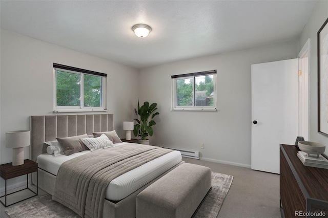 9743 W 67th Pl, Arvada, CO 80004 - carpeted bedroom with multiple windows, a baseboard radiator, and baseboards
