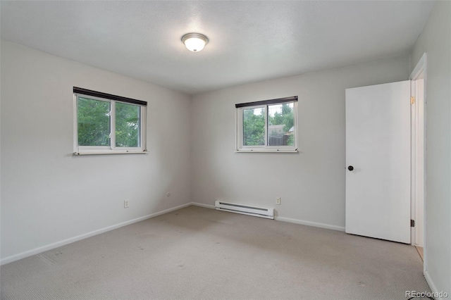 9743 W 67th Pl, Arvada, CO 80004 - carpeted empty room featuring baseboard heating, plenty of natural light, and baseboards
