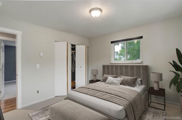 9743 W 67th Pl, Arvada, CO 80004 - bedroom featuring a closet, baseboards, and carpet flooring