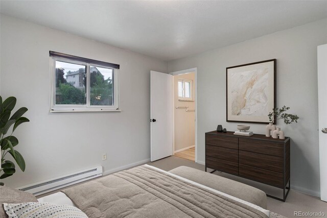 9743 W 67th Pl, Arvada, CO 80004 - bedroom with a baseboard heating unit, carpet floors, and baseboards