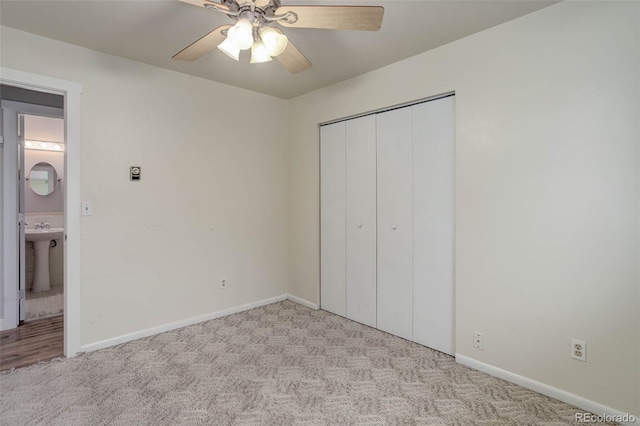 9743 W 67th Pl, Arvada, CO 80004 - unfurnished bedroom featuring carpet, a closet, baseboards, and ceiling fan