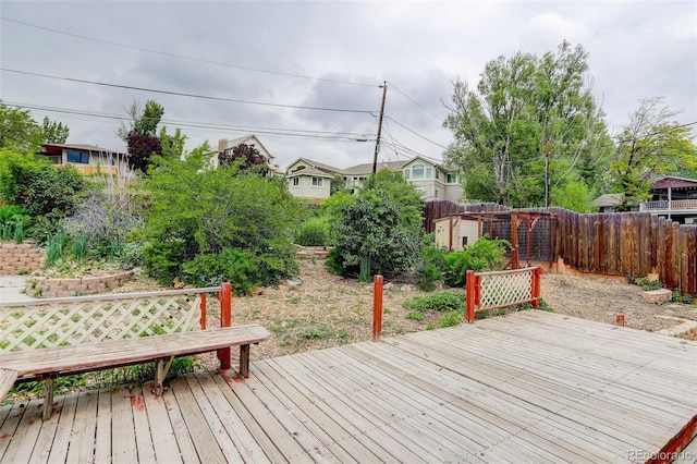 9743 W 67th Pl, Arvada, CO 80004 - wooden terrace featuring a fenced backyard and an outdoor structure