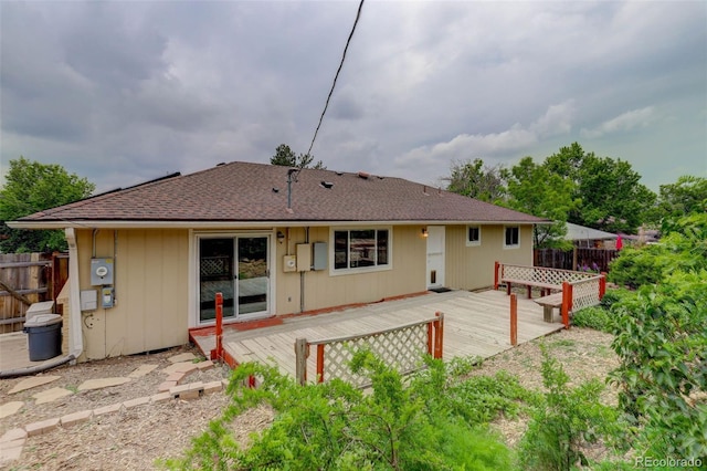 9743 W 67th Pl, Arvada, CO 80004 - back of property with a wooden deck and a shingled roof