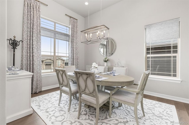 21972 E Allenspark Dr, Aurora, CO 80016 - dining space with dark wood-type flooring, a chandelier, baseboards, and recessed lighting