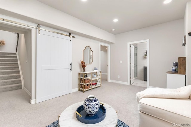 21972 E Allenspark Dr, Aurora, CO 80016 - living room with light colored carpet, recessed lighting, a barn door, stairway, and baseboards