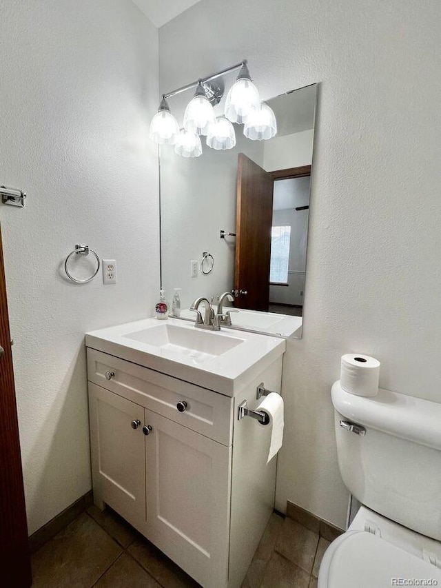 1115 W Swallow Rd Unit 20, Fort Collins, CO 80526 - half bathroom featuring tile patterned flooring and vanity