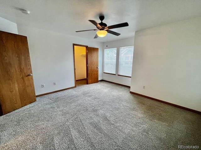 1115 W Swallow Rd Unit 20, Fort Collins, CO 80526 - unfurnished bedroom with carpet flooring, a walk in closet, and a ceiling fan
