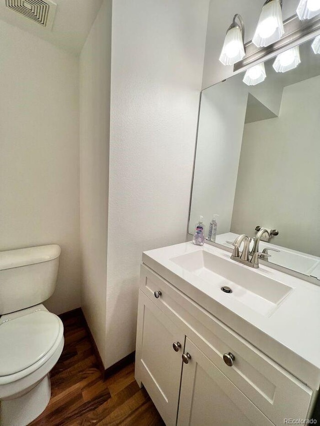 1115 W Swallow Rd Unit 20, Fort Collins, CO 80526 - half bathroom with wood finished floors and vanity