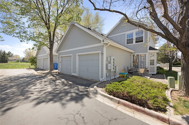 1115 W Swallow Rd Unit 20, Fort Collins, CO 80526 - view of front of property with driveway and an attached garage