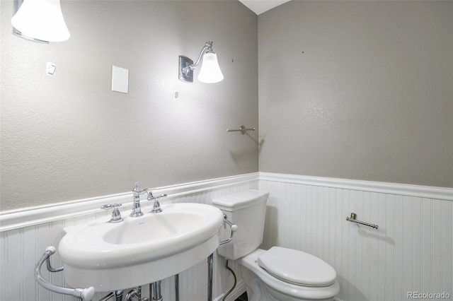 bathroom with toilet and sink