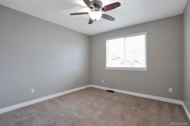 carpeted empty room with ceiling fan