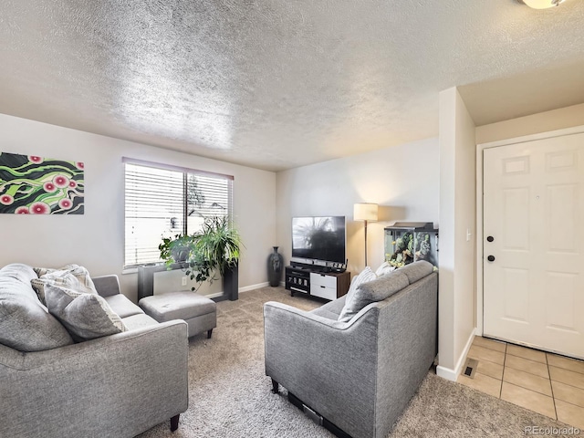 living room with light tile patterned floors and a textured ceiling