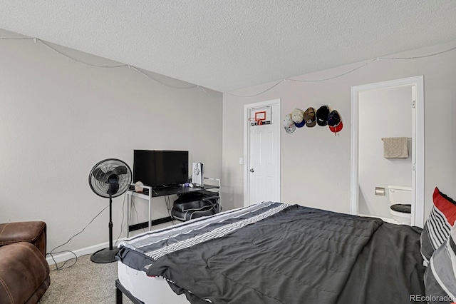 bedroom with carpet flooring, a textured ceiling, and baseboards