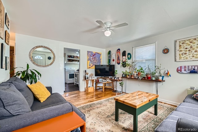 5424 Saulsbury Ct, Arvada, CO 80002 - living area with ceiling fan, wood finished floors, and baseboards