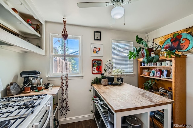 5424 Saulsbury Ct, Arvada, CO 80002 - kitchen featuring open shelves, dark wood finished floors, butcher block countertops, and baseboards