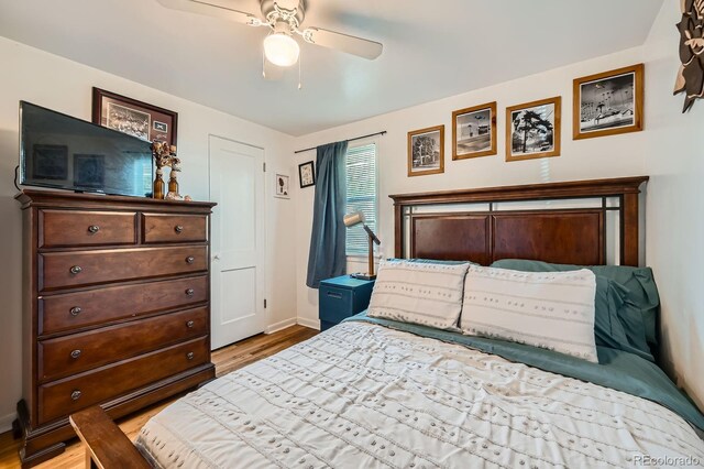 5424 Saulsbury Ct, Arvada, CO 80002 - bedroom with wood finished floors, baseboards, and ceiling fan