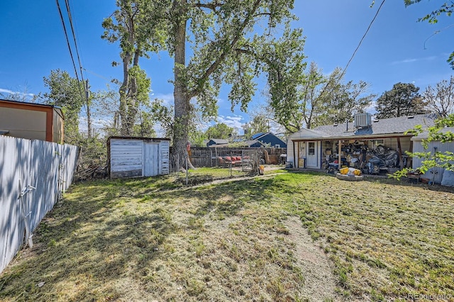 5424 Saulsbury Ct, Arvada, CO 80002 - view of yard with a storage unit and an outbuilding