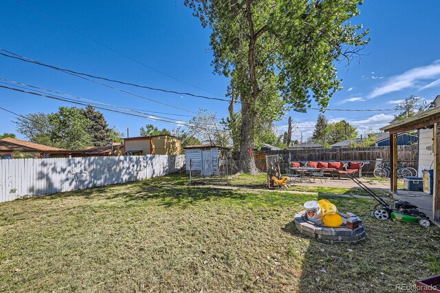 5424 Saulsbury Ct, Arvada, CO 80002 - view of yard featuring a patio, an outdoor living space, a shed, and an outbuilding