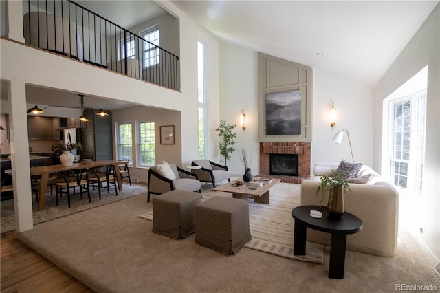7600 S Ulster Ct, Centennial, CO 80112 - living area featuring a brick fireplace and high vaulted ceiling
