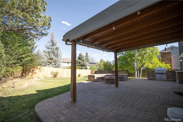 7600 S Ulster Ct, Centennial, CO 80112 - view of patio / terrace featuring an outdoor fire pit, an outdoor kitchen, and grilling area