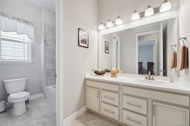 full bathroom featuring vanity, toilet, and tiled shower / bath combo