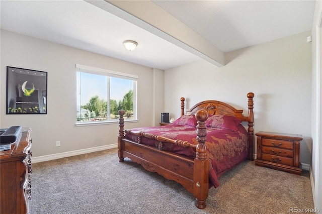 bedroom featuring beamed ceiling and carpet flooring